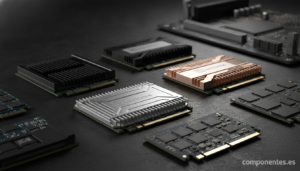 Close-up of multiple M.2 NVMe SSDs of different brands arranged on a dark technical surface with a motherboard PCIe slot v...